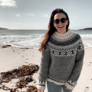 Picture of Tour Host, Leah, on a beach in Shetland.